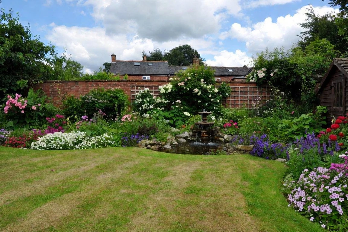A wildlife-rich British garden filled with flowers, water and layered habitat
